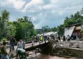 Pembersihan Jembatan di Desa Sima, Kecamatan Moga.